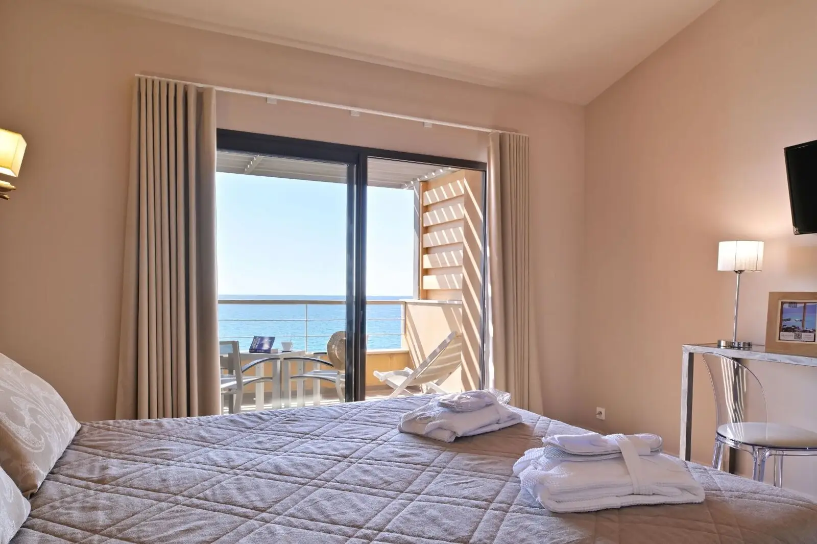 A room with a private terrace overlooking the Mediterranean